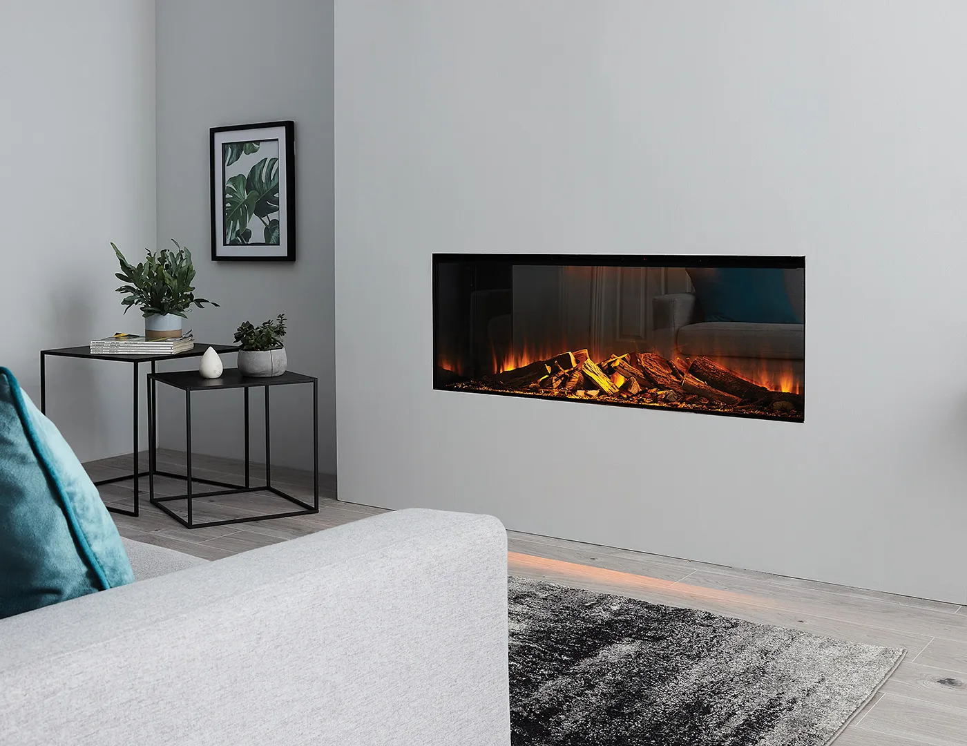 Electric fireplace with the flames visible from the front built into a wall in the living room