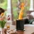 Medium matte black Volcano tabletop fire pit with clean stainless steel design