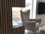 Foco Corner Left 800 - Modern left-sided corner bioethanol fireplace with sleek black design and tempered glass.