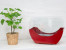 Red cradle shaped fireplace with glass panels