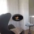 Ceiing-mounted bioethanol fireplace Cocoon Aeris Black with steel mounting rod
