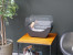 Cradle shaped fireplace in black with two glass panels