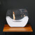 White cradle shaped fireplace with glass panels