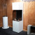 Elegant and tall freestanding fireplace in white with three glass panels