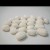 24 White ceramic pebbles