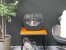 Cradle shaped fireplace in black with two glass panels